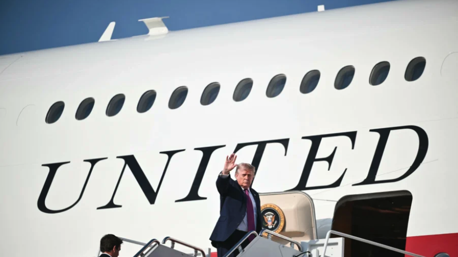 President Donald Trump waves as he boards Air Force One before departing Joint Base Andrews, Md., on July 3, 2026. (Mandel NGAN/AFP via Getty Images)