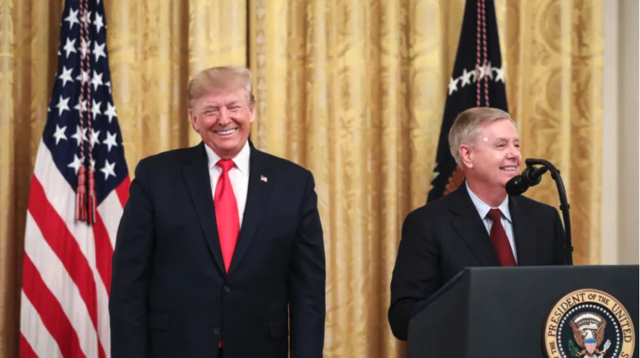 President Donald Trump (L) looks on as Sen. Lindsey Graham (R-S.C.) speaks during an event about judicial confirmations in the East Room of the White House on Nov. 6, 2019. (Drew Angerer/Getty Images)