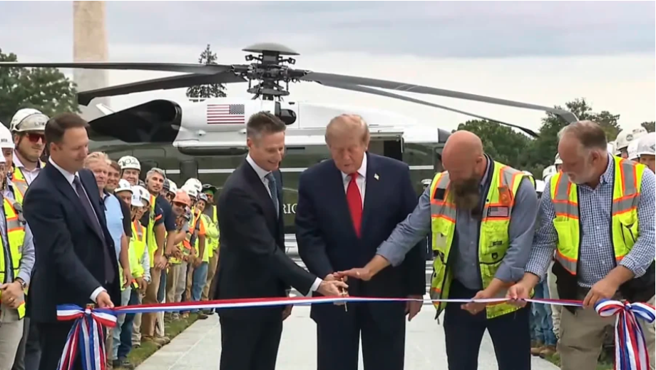 President Donald Trump cuts the ribbon at the official opening of the new White House Helipad on Sept. 21, 2026. (The White House via Youtube/Screenshot via The Epoch Times)